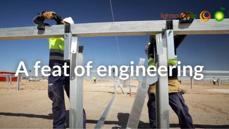Workers on a solar farm with text overlay saying 